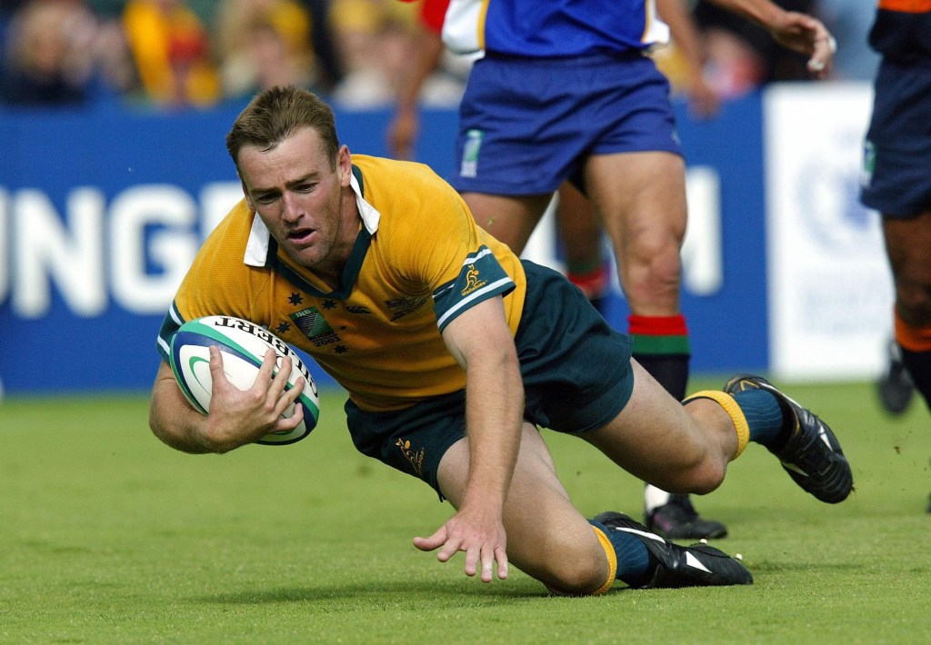 File photo dated 25-10-2003 of Chris Latham goes over to score the second of his five tries in Australia's 142-0 victory over Namibia . Photo credit  David Davies/PA Wire.