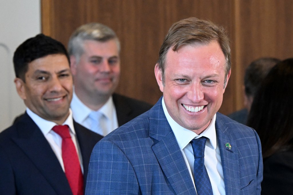 Queensland Premier Steven Miles (right) is seen with his new ministers during a press conference in Brisbane, Monday, December 18, 2023. (AAP Image/Darren England) 