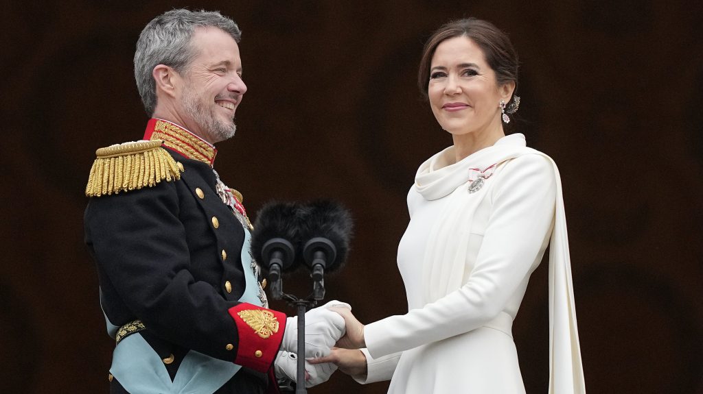 Denmark's King Frederik X and Denmark's Queen Mary hold hands on the balcony of Christiansborg Palace in Copenhagen, Denmark, Sunday, Jan. 14, 2024. (AP Photo/Martin Meissner)