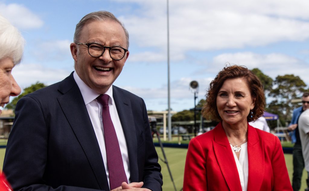 Australian Prime Minister Anthony Albanese (centre) and Candidate for Dunkley Jodie Belyea (right) pose for a photograph at the Frankston Bowling Club in Melbourne. (AAP Image/Diego Fedele) 