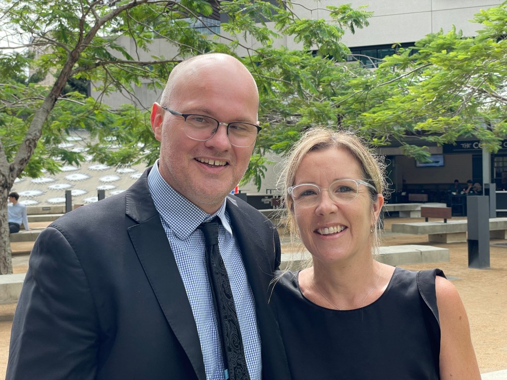 Jess and Jackie Morecroft outside Brisbane Supreme Court, Brisbane, Friday, February 9, 2024. The Queensland government has lost its bid to avoid paying $2.7 million to a couple who lost their house after the property was sold to them under fraudulent circumstances. (AAP Image/Rex Martinich) NO ARCHIVING