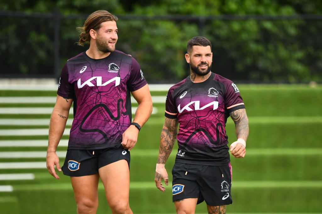 Broncos players Patrick Carrigan and Adam Reynolds look on during a Brisbane Broncos NRL training session at Clive Berghofer Field, in Brisbane, Tuesday, (AAP Image/Jono Searle)
