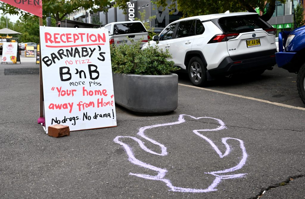 An outline is seen next to a planter box where Shadow Minister for Veterans' Affairs Barnaby Joyce was filmed intoxicated on his back, talking in his phone at 11.30pm last Wednesday night in Canberra, Thursday, February 15, 2024. (AAP Image/Lukas Coch) 