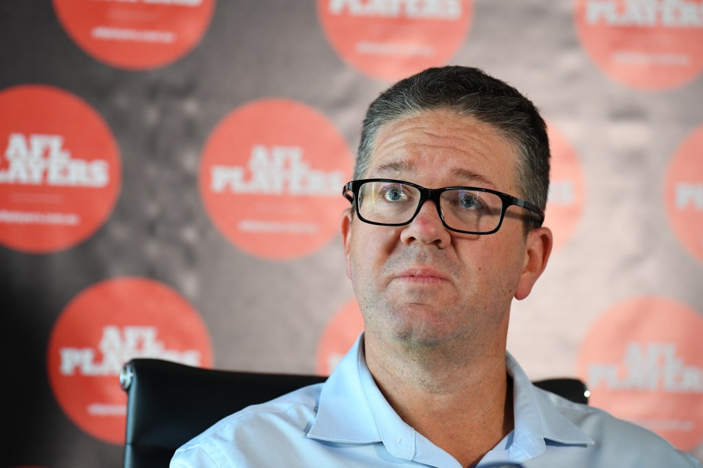 The AFL Players' Association (AFLPA) CEO Paul Marsh addresses the media on the AFLPA Boards position regarding COVID-19 during a press conference at AFLPA Office in Melbourne, Tuesday, March 17, 2020. Marsh has announced that both AFL and AFLW playing groups are prepared to play as soon as they are given the green light by the AFL. (AAP Image/James Ross) NO ARCHIVING