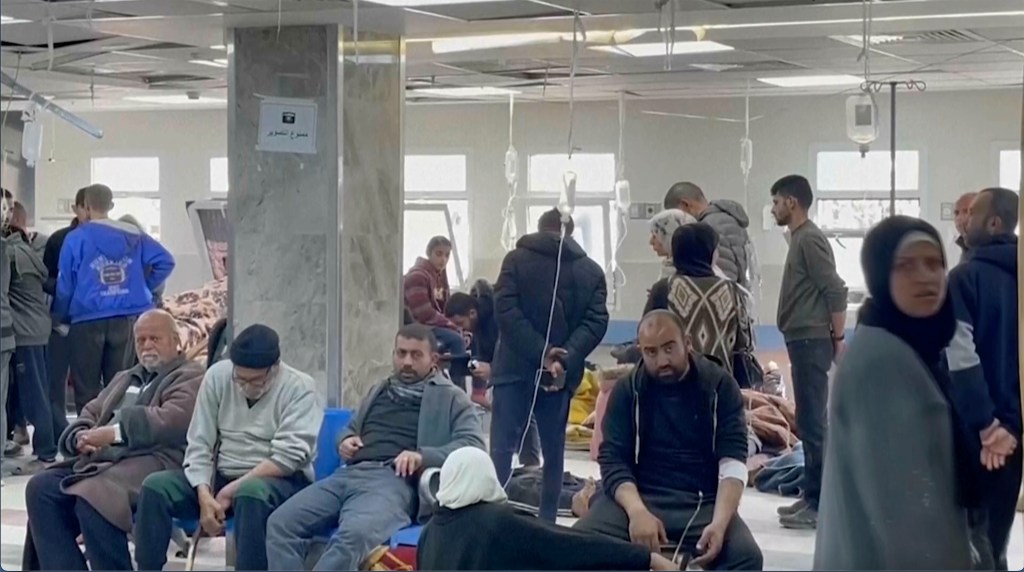 Injured people sit inside Shifa Hospital on Thursday, Feb. 29, 2024 in Gaza City.  Israeli troops fired on a crowd of Palestinians waiting for aid in Gaza City on Thursday, witnesses said. (AP Photo)