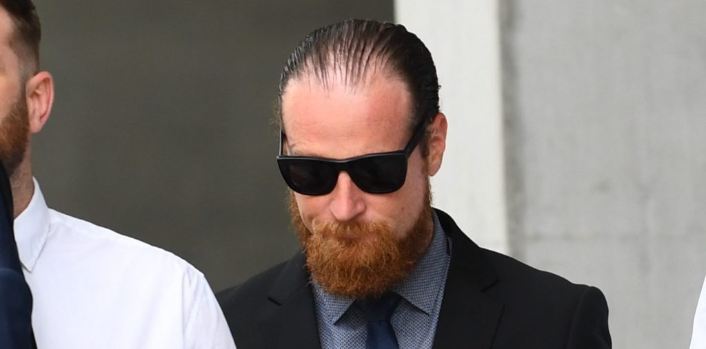 Simon Cross (middle) leaves the Brisbane District Court in Brisbane,
Monday, March 4, 2024. (AAP Image/Jono Searle) NO ARCHIVING