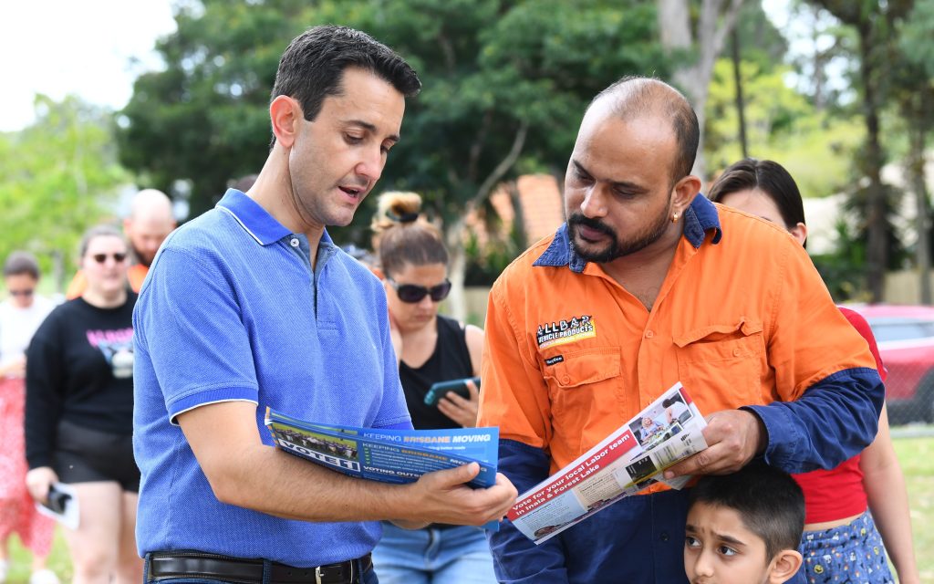 Leader of the Opposition David Crisafulli talks to a voter at a school in Inala, Saturday, March 16, 2024. The Inala electorate was the former seat of retired Queensland Premier Annastacia Palaszczuk. (AAP Image/Jono Searle) 