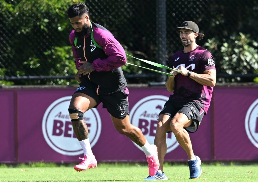 Payne Haas (left) is seen during a Brisbane Broncos NRL training session at Clive Berghofer Field in Brisbane, Wednesday, March 20, 2024. (AAP Image/Darren England) 