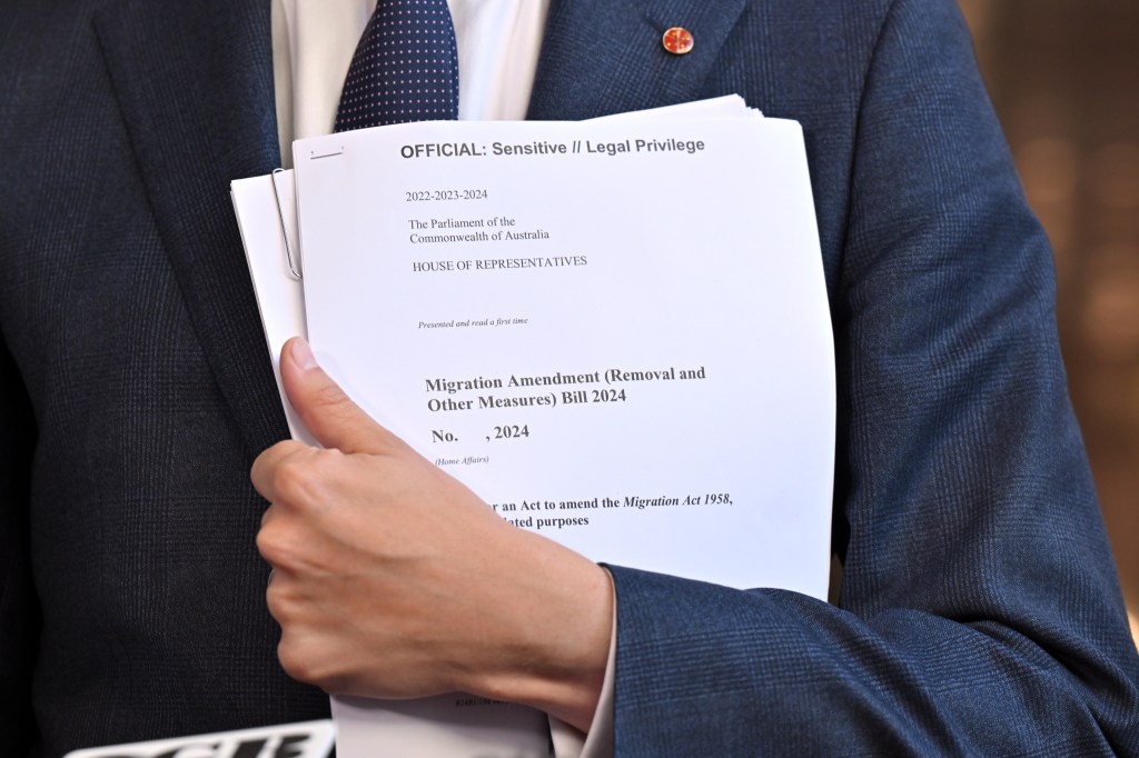 The government is considering rushing through new legislation close a legal loophole for detainees (AAP Image/Mick Tsikas) 