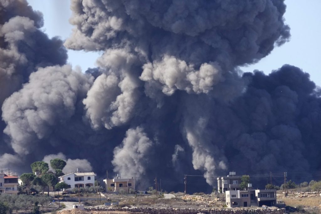 FILE - Black smoke rises from an Israeli airstrike on the outskirts of Aita al-Shaab, a Lebanese border village with Israel in south Lebanon, Saturday, Nov. 4, 2023. A war of words that has unfolded in Lebanon show longstanding schisms in the small country over Hezbollah, now amplified by the militant group's role in the Lebanon-Israel border clashes and by fears that an already crisis-hit Lebanon could be dragged into an all-out war. (AP Photo/Hussein Malla, File)