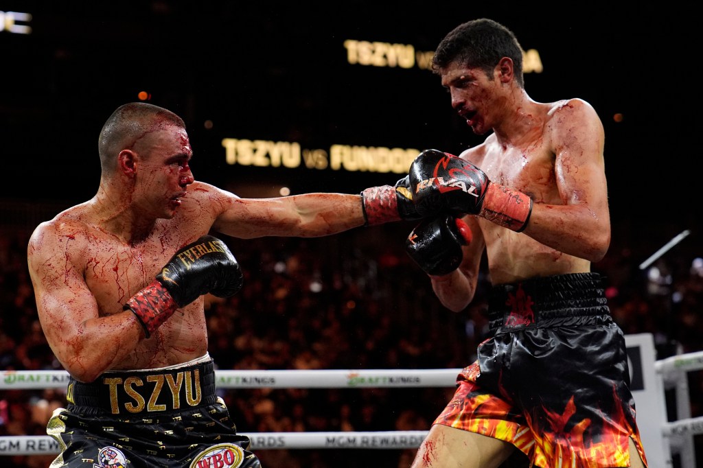 Tim Tszyu, of Australia, left, fights Sebastian Fundora in a super welterweight title bout Saturday, March 30, 2024, in Las Vegas. (AP Photo/John Locher)