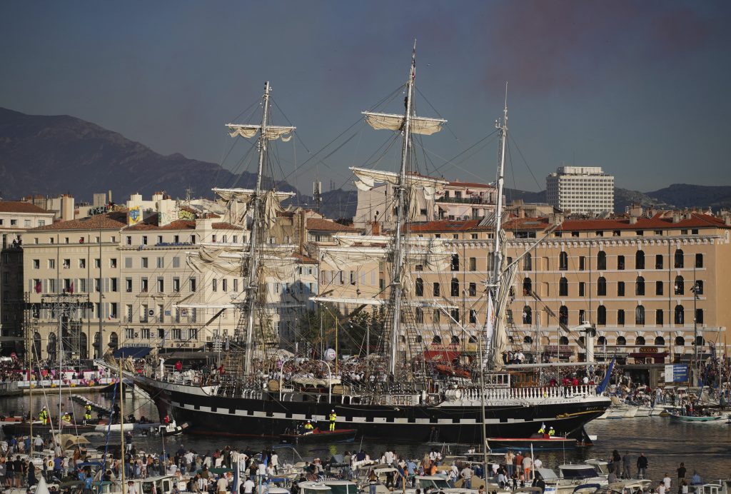 The Belem, the three-masted sailing ship which is carrying the Olympic flame, enters the Old Port in Marseille, southern France, Wednesday, May 8, 2024. The torch was lit in Greece last month before it was officially handed to France. The Paris 2024 Olympic Games will run from July 26 to Aug.11, 2024. (AP Photo/Daniel Cole)