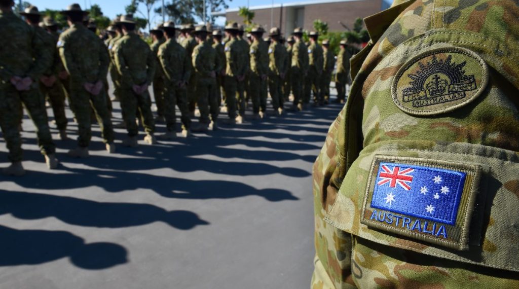 Australian Defence Force (ADF) personnel are seen during an official farewell at the Gallipoli Barracks in Brisbane, Tuesday, April 21, 2015. Around 300 ADF members, primarily from Brisbane's 7th Brigade will join around 100 personnel from the New Zealand Defence Force in Iraq, to form Task Force Taji. The soldiers will help train local Iraqi forces in the International fight against Islamic State (IS) militants. (AAP Image/Dave Hunt) NO ARCHIVING.