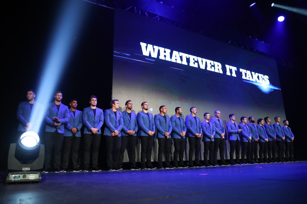 The NSW Blues Origin team stand on stage after being unveiled during the NSW State of Origin team announcement for Game 1 in Sydney, Monday, May 28, 2018. (AAP Image/Brendon Thorne) 