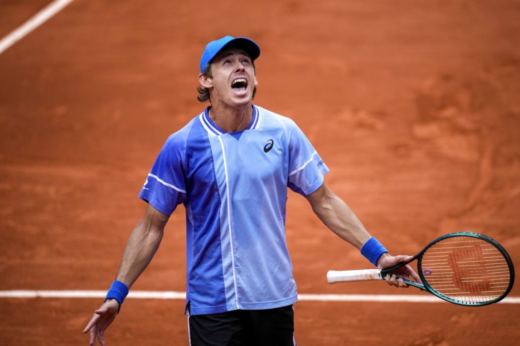 Australia's Alex De Minaur celebrates winning his fourth round match of the French Open tennis tournament against Russia's Daniil Medvedev at the Roland Garros stadium in Paris, Monday, June 3, 2024. (AP Photo/Christophe Ena)