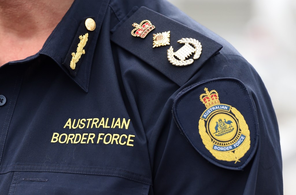 Australian Border Force logos and rank are seen on the uniform worn by Commissioner Roman Quaedvlieg in Brisbane. (AAP Image/Dan Peled) 