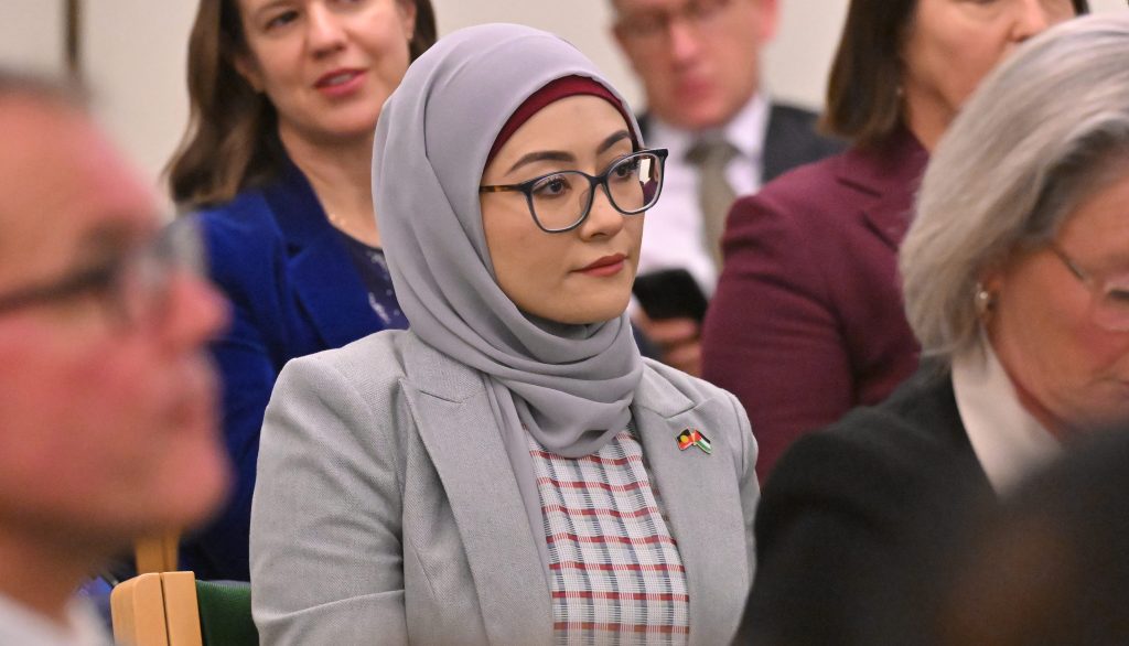 Labor senator Fatima Payman listens to Prime Minister Anthony Albanese addressing a Labor caucus meeting at Parliament House in Canberra, Tuesday, June 25, 2024. (AAP Image/Mick Tsikas)