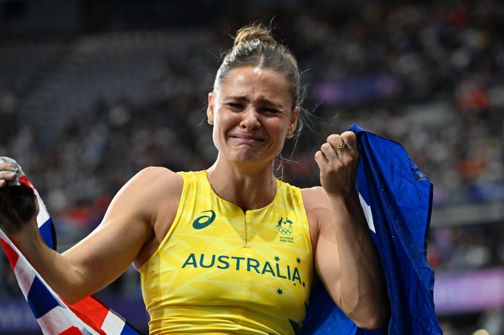 Australian pole vaulter Nina Kennedy reacts after winning a gold medal in the Women's Pole Vault Final at the Stade de France in Saint-Denis, as part of the 2024 Paris Summer Olympic Games in, France, Wednesday, August 07, 2024. (AAP Image/Dean Lewins) NO ARCHIVING