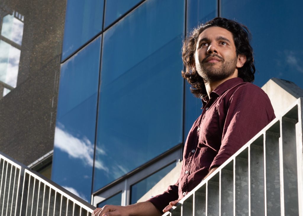 A supplied image obtained on Monday, August 12, 2024, of David Corporal, an Eastern Arrente man and engineering student at Queensland University of Technology as he poses for a photo on campus in Brisbane. Corporal is one of five Indigenous university students heading to the United States for an internship program, where they'll be mentored by NASA scientists and engineers. (AAP Image/Supplied by QUT, Anthony Weate)