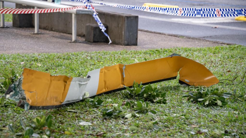 Debris from the crashed helicopter which collided with the Double tree hotel in Cairns CBC.