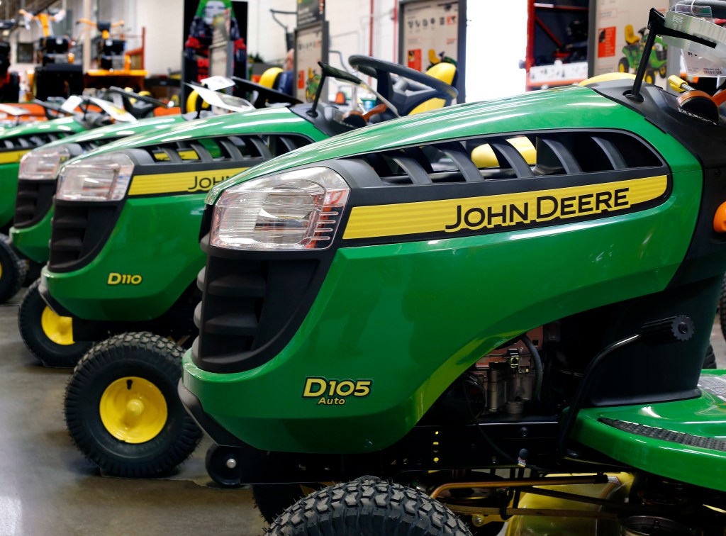 FILE - In this March 23, 2015, file photo, John Deere lawn tractors are on display at a Home Depot in Robinson Township, Pa. Wall Street is flooding into the agricultural sector on reports that the Trump administration is preparing a plan that would send billions in aid to U.S. farmers hurt by tariffs. CF Industries Holding and Mosaic Company both traded up more than 3 percent, while Deere &amp; Co. shot up more than 4 percent after news of the aid package was leaked to The Associated Press by two people briefed on the plan. (AP Photo/Gene J. Puskar, File)