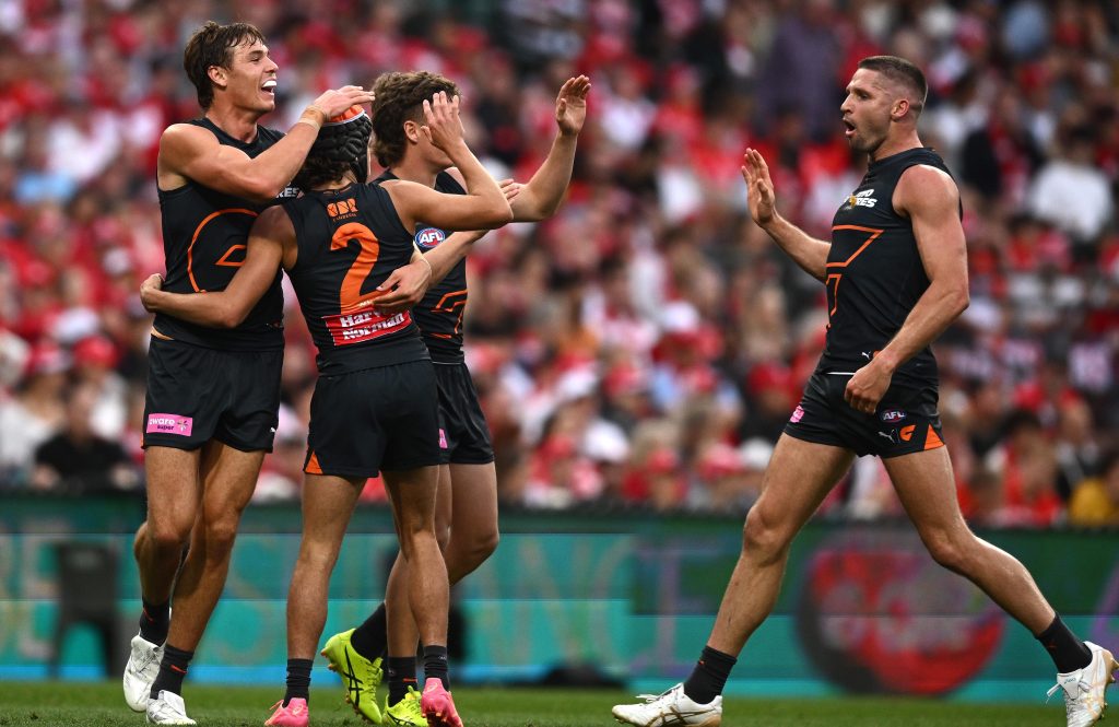 Darcy Jones of the Giants (second left) celebrates with teammates after kicking a goal during the AFL Qualifying Final match between the Sydney Swans and the GWS Giants at the Sydney Cricket Ground Saturday, September 7, 2024. (AAP Image/Dan Himbrechts) NO ARCHIVING, EDITORIAL USE ONLY