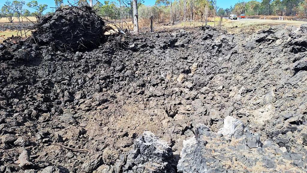 the massive crater left by last week's collision and explosion on the Bruce Highway (ABC image).