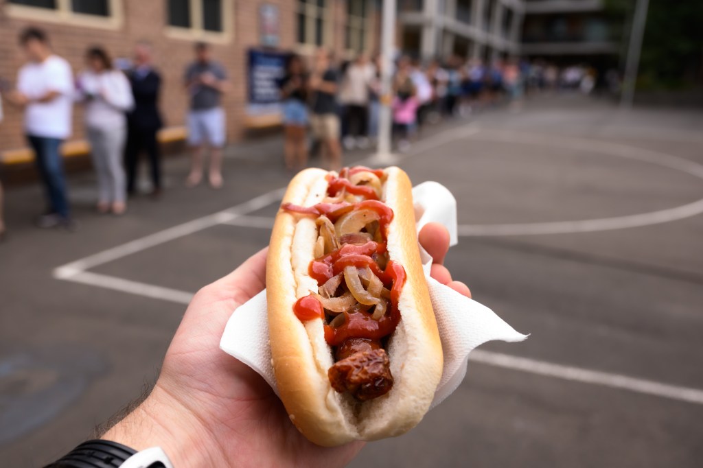 A sausage sizzle on NSW state election day, in the seat of Ryde, in Sydney, Saturday, March 25, 2023. More than four million New South Wales voters will head to the polls today to determine the 58th Parliament of NSW. (AAP Image/James Gourley) NO ARCHIVING